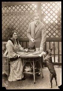 Julie Opp and William Faversham with their Boston Terrier, 1914